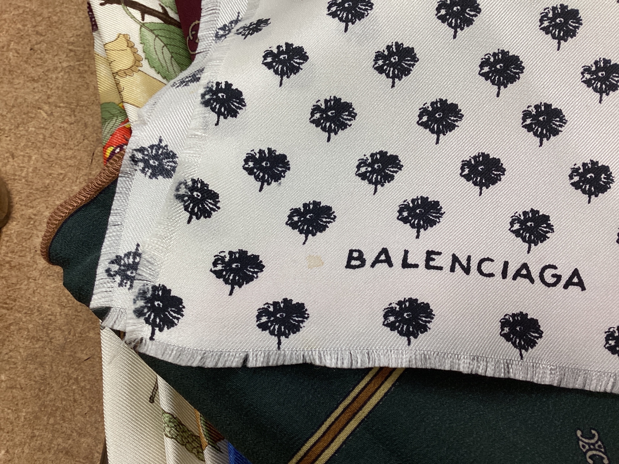 Three Gucci silk scarves, two by Celine and one by Balenciaga